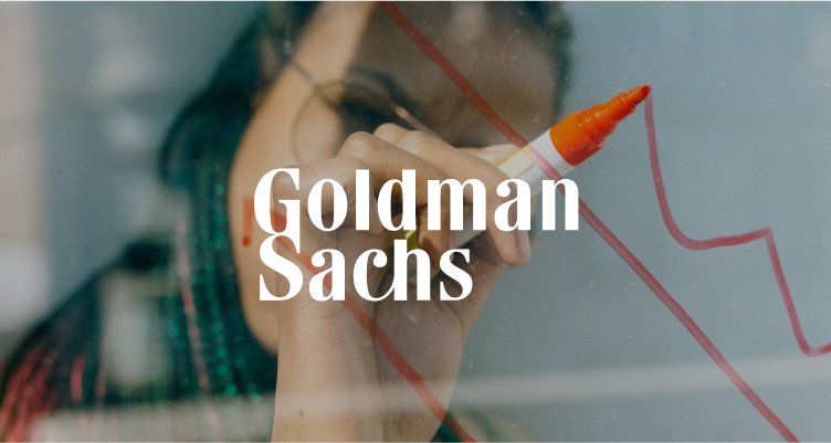 Goldman Sachs logo overlaid on image of person drawing upwards graph on glass